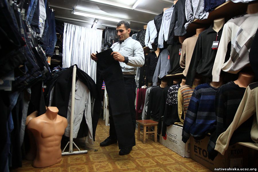 Husniddin Yusupov sells Turkish-made clothing at Bishkek's largest market, Dordoi.