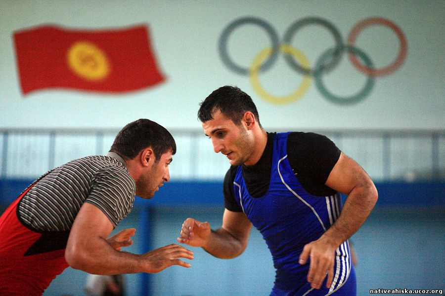 Hasan Hamdiev (right) spars with his team-mate Husniddin Yusupov during his wrestling class in Bishkek.